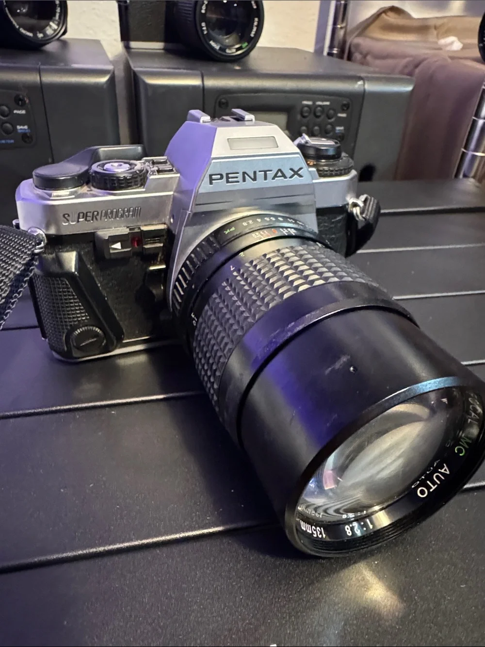 Pentax Silver and Black SLR with 135mm Telephoto Lens